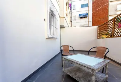 a small balcony with a table and two chairs at Apartment City of Arts and Sciences 1 in Valencia