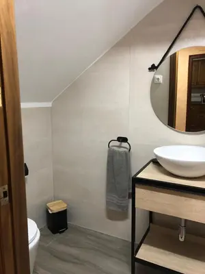 a bathroom with a sink and a mirror at Cases Rurals El Castell in Torres-Torres