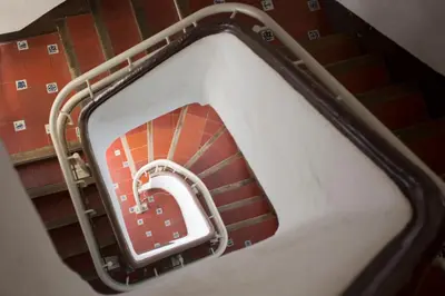 an ascending staircase with a red and white at El Micalet Apartment in Valencia