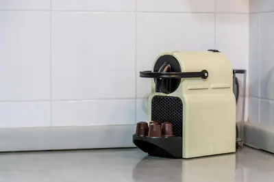 a toaster sitting in a kitchen with a group of shoes at Travel Habitat Plaza del Pilar. in Valencia