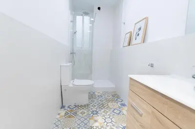 a bathroom with a toilet and a sink and a toilet at Concept Rooms in Valencia