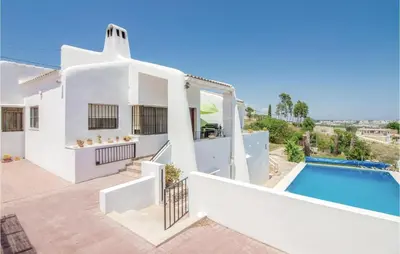 a white villa with a swimming pool at Nice Home In Alberique in Alberique