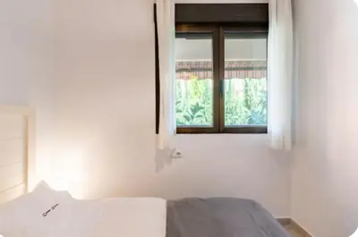 a bedroom with a bed and a window at Casa Dora Puzol playa in Puzol
