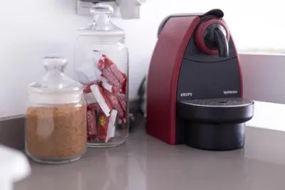 a kitchen counter with a blender and a bottle of food at Cozy fisherman's house in Valencia