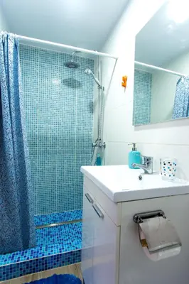 a bathroom with a sink and a shower at Versus Apartments near City of Arts in Valencia