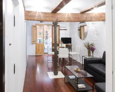 a living room with a couch and a table at Apartments Downtown Valencia in Valencia