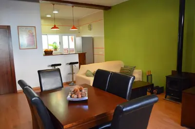 a living room with a table and chairs and a couch at Casa Rural La Tramontana in Estivella