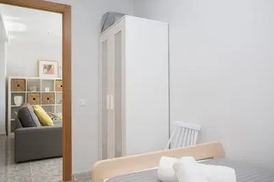 a bedroom with a bed and a couch at SingularStays El Faro in Puzol