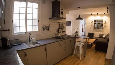 a kitchen with a sink and a counter top at Valencian Apartment in Valencia