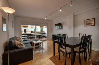 a living room with a table and a dining room at Beds & Breaks Ferrero in Valencia