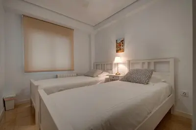 a kitchen with wooden cabinets and a sink at Beds & Breaks Ferrero in Valencia