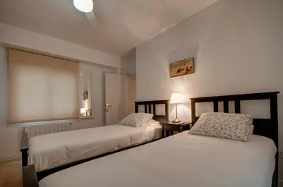 two beds sitting next to each other in a room at Beds & Breaks Ferrero in Valencia