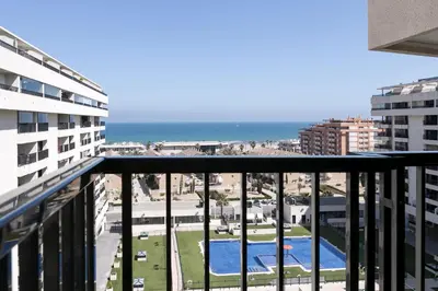 a balcony with a view of the ocean at ApartUP Patacona Horizon in Valencia
