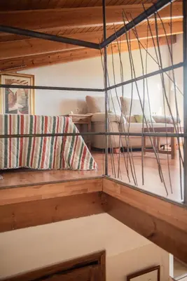 a room with a bunk bed and a couch at El Secanet in Algimia de Alfara