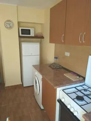 a kitchen with a stove and a washer and dryer at Apartment in Valencia in Valencia