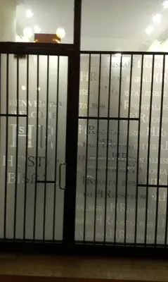 a glass door with a bunch of numbers on it at Hostal Bisbal ONLY ADULTS NO AC in Valencia