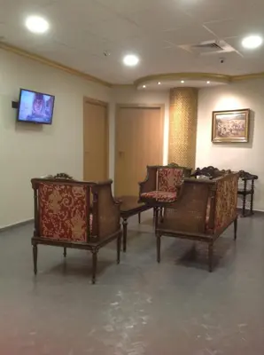 a waiting room with chairs and a tv on the wall at Hostal Bisbal ONLY ADULTS NO AC in Valencia