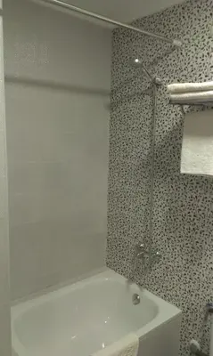 a bathroom with a shower and a white sink at Hostal Bisbal ONLY ADULTS NO AC in Valencia