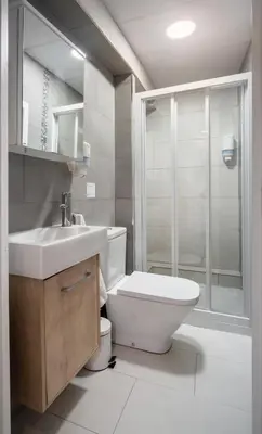 a bathroom with a toilet and a sink and a shower at San Jaime Silence in Valencia