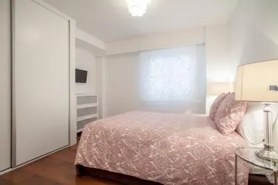 a bedroom with a bed and a glass table at Hi Valencia Apartments - Jorge Juan in Valencia