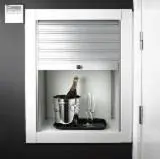 a white cabinet with a bottle of wine in it at Shhh in Onda