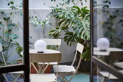 a room with plants and a table and chairs at Bubusuites in Valencia