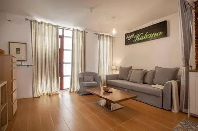 a living room with a couch and a coffee table at Habana Apartment in Valencia