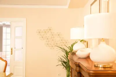 a room with a table with a lamp and a plant at MD Villa Cullera Cap Blanc in Faro de Cullera