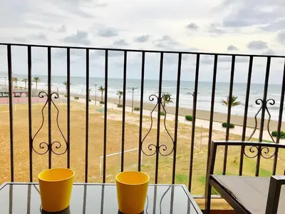 a balcony with a view of the beach at Apartamento PortSaplaya in Port Saplaya
