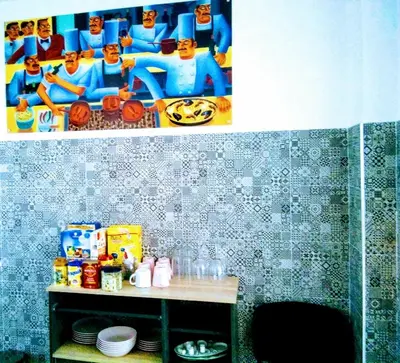 a bathroom with a wall with a picture on the wall at New Trendy apartment in Valencia