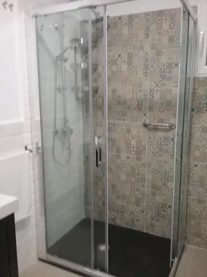 a shower with a glass door in a bathroom at New Trendy apartment in Valencia