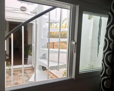 a window with a view of a balcony at Casa Cabanyal in Valencia