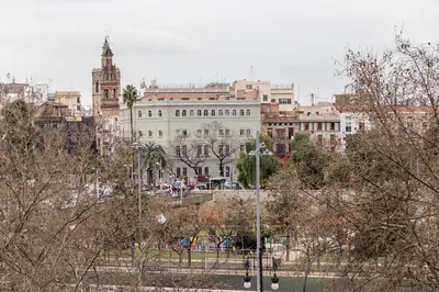a view of a city with buildings and trees at Travel Habitat Jardines Rio Turia. in Valencia