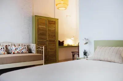 a bedroom with a bed and a couch at OttoH Charm Stay in Valencia