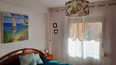 a bedroom with a bed and a window at Casa de Maria in Valencia
