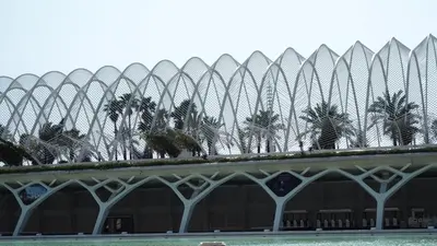 a building with palm trees in front of it at Casa de Maria in Valencia