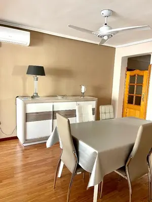 a dining room with a table and chairs at Apartamento Playa el Cabanyal in Valencia
