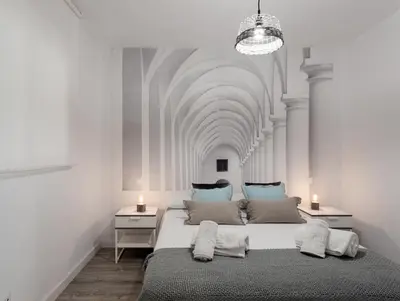 a bedroom with a large bed with a ceiling at TTdSSa VLC Purísima Street in Valencia