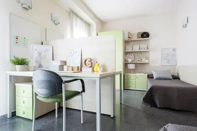 a room with a desk and a chair and a bed at Residencia Universitaria Resa Damia Bonet in Valencia