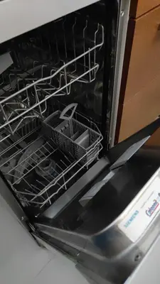 an oven with dishes in the dish racks at Apartamento in Valencia