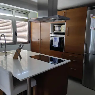 a kitchen with a white counter top and a refrigerator at Apartamento in Valencia