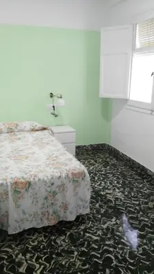 a bedroom with a bed in a room at Cullera Beach by Zagal Apartments in Cullera