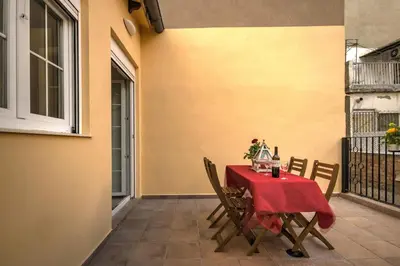 a table and chairs on the patio of a house at Beds & Breaks Verdi 2 in Valencia