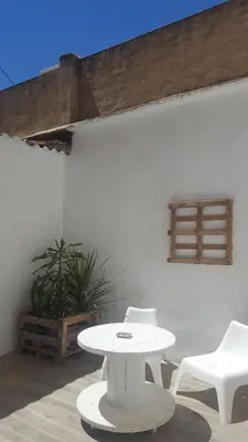 a white table and two white chairs on a patio at Domus Valencia Apartamentos Loft zona Pechina in Valencia