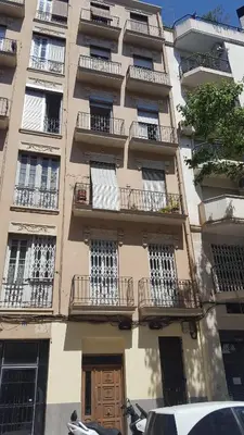 a tall building with balconies on the side of it at Domus Valencia Apartamentos Loft zona Pechina in Valencia