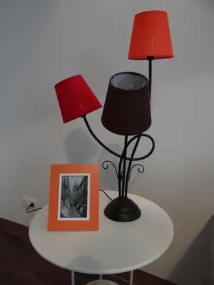 a table with two lamps and a picture on it at Valencia what else... in Valencia
