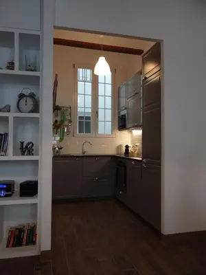 a kitchen with stainless steel appliances and a window at Valencia what else... in Valencia