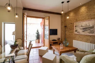 a living room with a couch and a table at MD Sueca in Valencia
