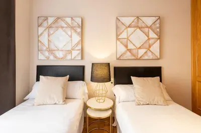 two beds sitting next to each other in a room at MD Abastos in Valencia