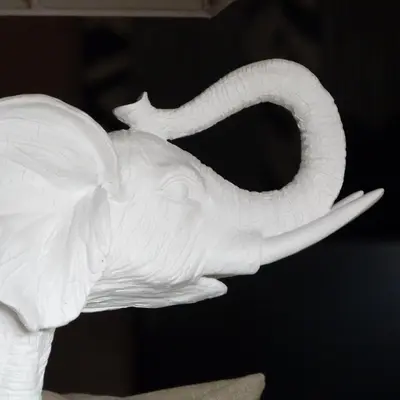a white elephant statue sitting on top of a table at Dalt Vila in Eslida
